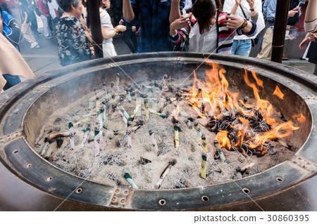 worshiping the shrine through incense in Sensoji worshiping the shrine through incense in Sensoji 30860395