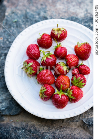 Strawberries on stone, rustic 30862409