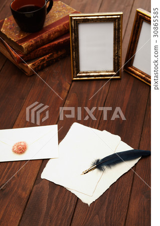 Feather pen, letter, picture frame, book, coffee 30865585
