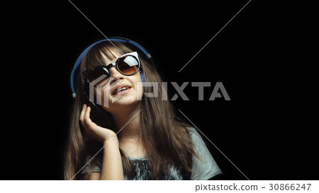Young Cute Girl with Headphones and Sunglasses Young Cute Girl with Headphones and Sunglasses 30866247