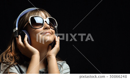 Young Cute Girl with Headphones and Sunglasses Young Cute Girl with Headphones and Sunglasses 30866248