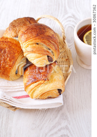 Sweet chocolate buns and cup of tea Sweet chocolate buns and cup of tea 30867362