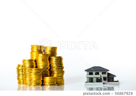 House model and lots of gold coins, white background 30867929