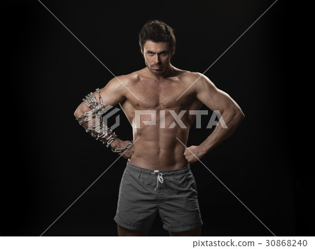 Muscular man with chain on arm Muscular man with chain on arm 30868240