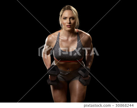 Muscular woman with dumbbells Muscular woman with dumbbells 30868244
