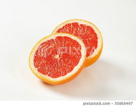 Halved red grapefruit Halved red grapefruit 30868497