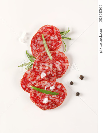 slices of French dry cured salami with spices 30868563