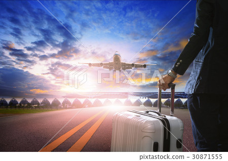 man and traveling lugage standing in airport man and traveling lugage standing in airport 30871555