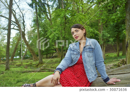 A woman in a forest A woman in a forest 30871636