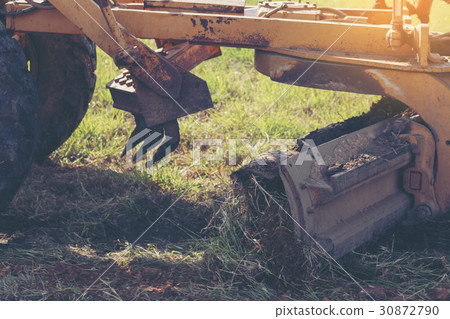 Grader leveling landfill on construction site Grader leveling landfill on construction site 30872790