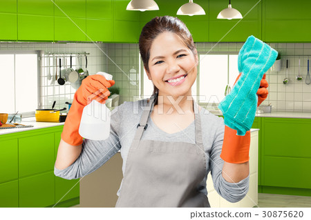 asian housekeeper holding spray bottle and rag asian housekeeper holding spray bottle and rag 30875620