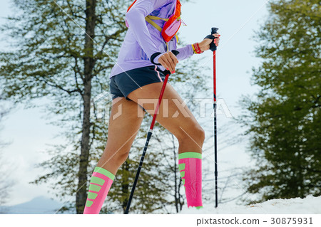 female running mountain snowy trail female running mountain snowy trail 30875931