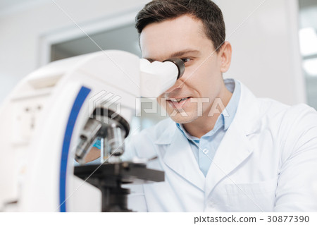 Positive delighted scientist looking into 30877390