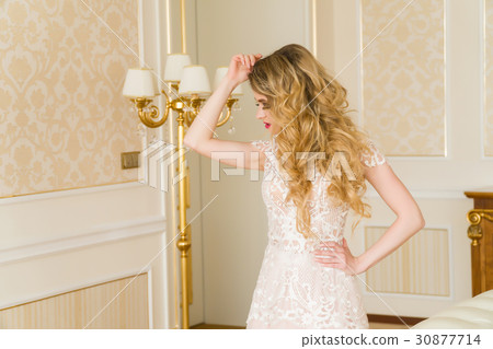 Portrait of beautiful young bride. A girl is 30877714