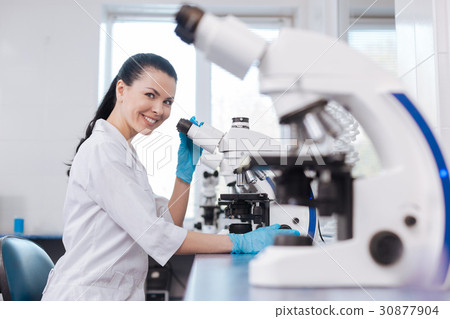 Positive delighted researcher looking at camera 30877904