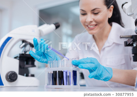 Portrait of pretty woman while working in lab Portrait of pretty woman while working in lab 30877955