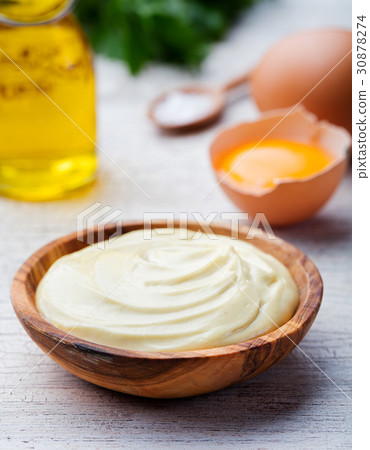 Homemade mayonnaise, mayo in a wooden bowl. 30878274
