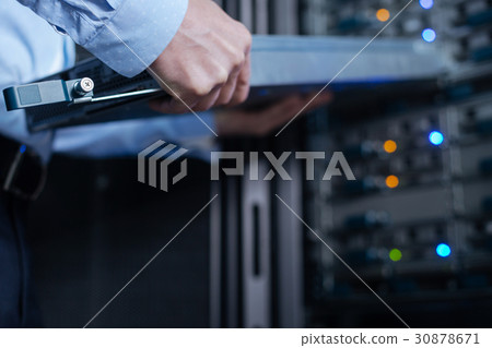 Rack server being in hands of a professional Rack server being in hands of a professional 30878671