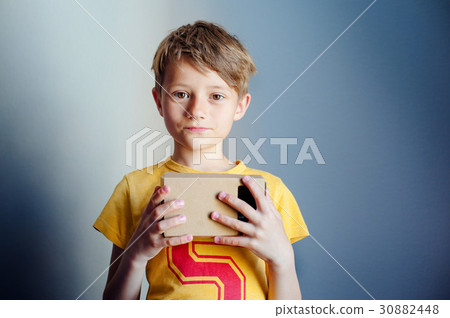 The boy is holding virtual reality googles, VR The boy is holding virtual reality googles, VR 30882448