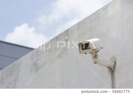The CCTV camera attach at the concrete wall 30882773