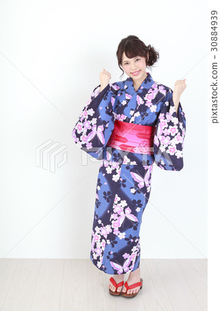 A young girl in a yukata puzzling pose A young girl in a yukata puzzling pose 30884939
