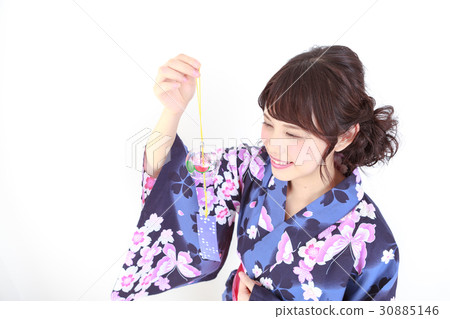 Young lady with wind chimes and yukata 30885146