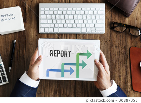Businessman Using Digital Device Working on the Wooden Table 30887353