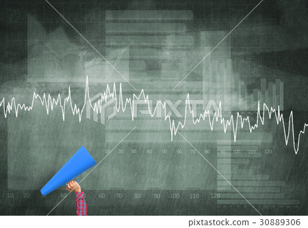 Hand of woman holding blue paper trumpet against graphs background 30889306
