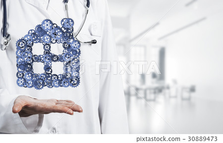 Symbol of homepage or accomodation made with cogwheels presented in female palms 30889473