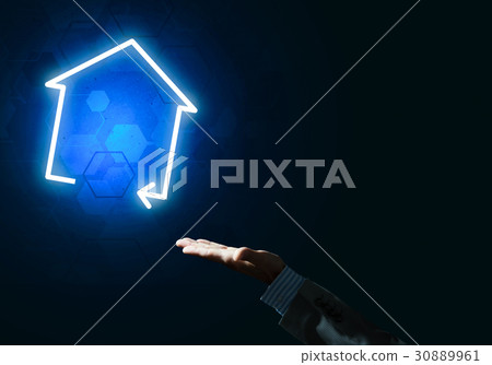 Conceptual image with hand pointing at house or main page icon o Conceptual image with hand pointing at house or main page icon o 30889961