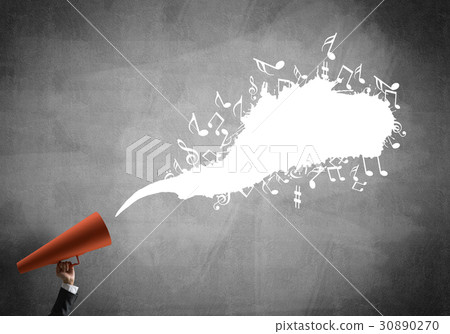 Hand of businesswoman holding red paper trumpet against concrete background Hand of businesswoman holding red paper trumpet against concrete background 30890270