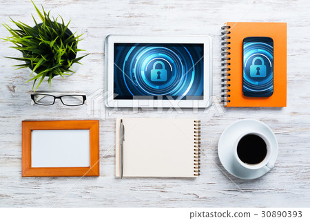 Web security and technology concept with tablet pc on wooden table 30890393