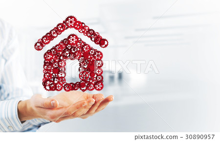 Symbol of homepage or accomodation made with cogwheels presented in male palms 30890957