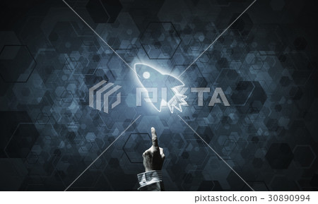 Technology idea concept with glowing rocket icon and touching it finger Technology idea concept with glowing rocket icon and touching it finger 30890994