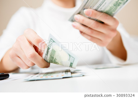 Hands counting money, close up Hands counting money, close up 30893324
