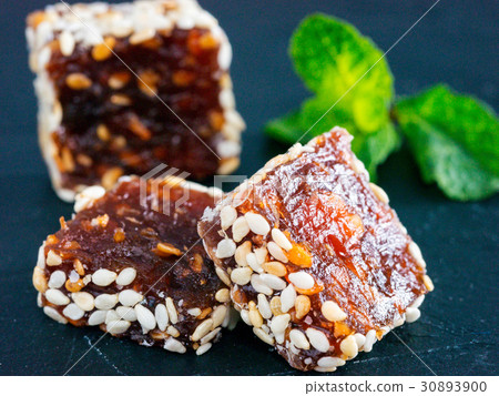 Turkish delight on black rustic background Turkish delight on black rustic background 30893900