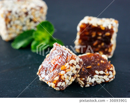 Turkish delight on black rustic background Turkish delight on black rustic background 30893901