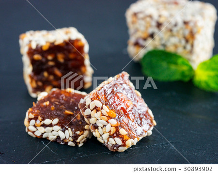 Turkish delight on black rustic background Turkish delight on black rustic background 30893902
