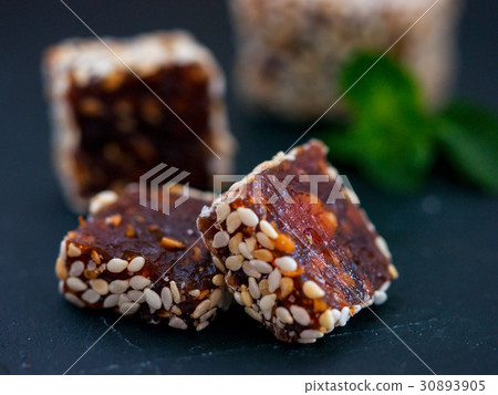 Turkish delight on black rustic background Turkish delight on black rustic background 30893905