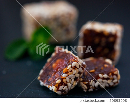 Turkish delight on black rustic background Turkish delight on black rustic background 30893908