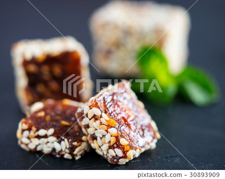 Turkish delight on black rustic background Turkish delight on black rustic background 30893909