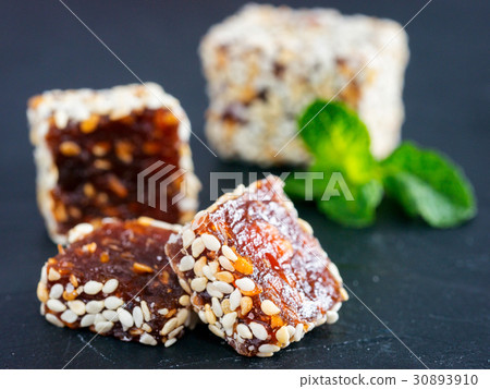 Turkish delight on black rustic background Turkish delight on black rustic background 30893910