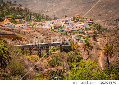 Ancient mill and aqueduct in Fataga 30894479