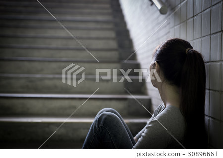 depressed woman in underground 30896661
