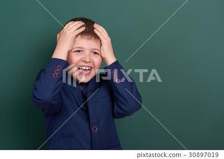 school boy portrait near green blank background school boy portrait near green blank background 30897019