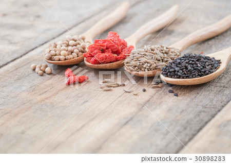 Herb ingredient for cooking on wooden spoon 30898283