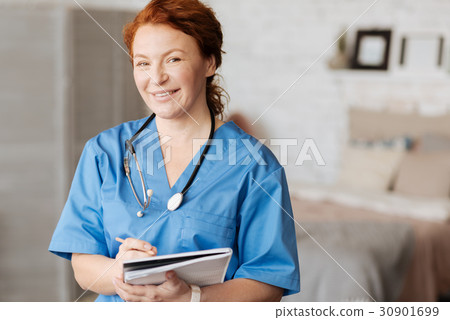 Cheerful excellent doctor holding consultation at 30901699
