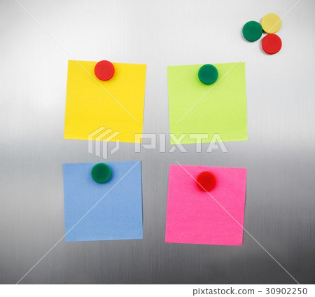 Coloured notes and magnets on inox metallic fridge 30902250