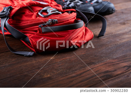 Hiking equipment: backpack and trekking boots on Hiking equipment: backpack and trekking boots on 30902280
