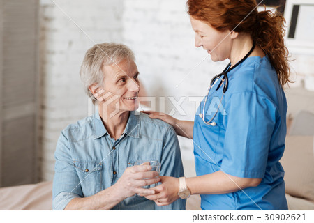 Nice gentle nurse fulfilling her duty Nice gentle nurse fulfilling her duty 30902621